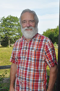 Sam Eliot on the porch of his writing haven and condo on Mount Desert Island